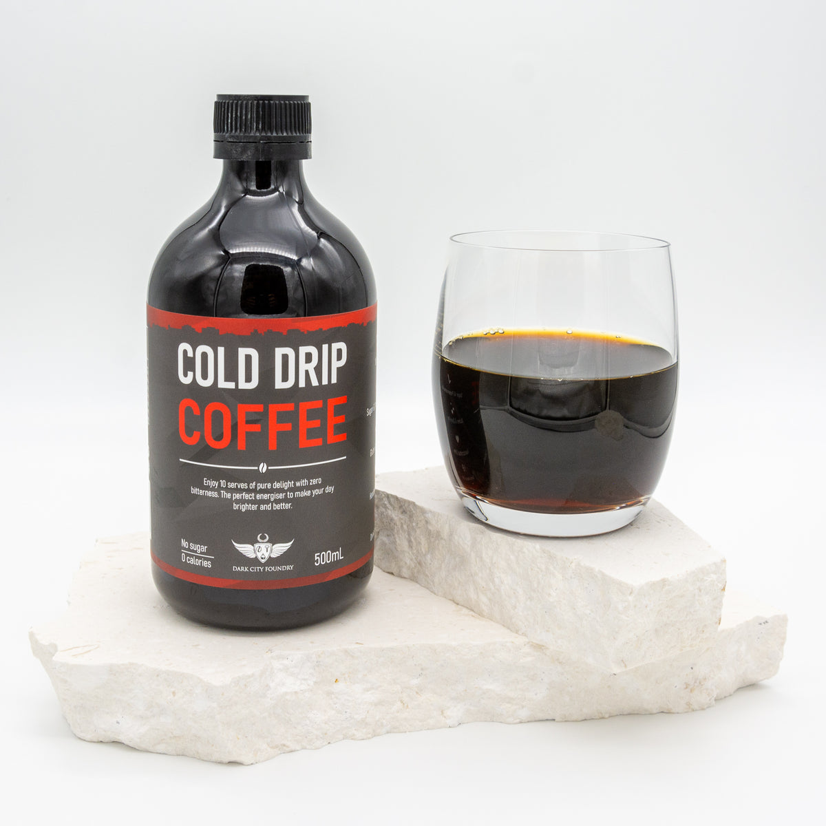 500ml bottle of cold drip coffee pictured with a glass of coffee next to it